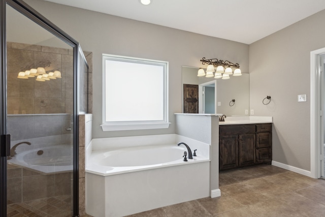 bathroom featuring vanity, shower with separate bathtub, and tile patterned flooring