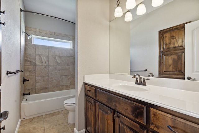 full bathroom with vanity, toilet, tiled shower / bath combo, and tile patterned flooring