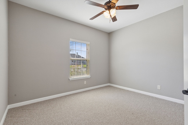 unfurnished room with carpet flooring and ceiling fan