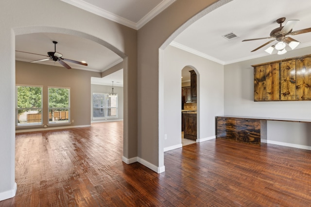 unfurnished living room featuring crown molding, ceiling fan with notable chandelier, and dark hardwood / wood-style flooring