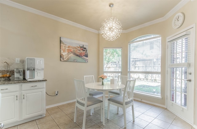 dining room with a notable chandelier, ornamental molding, and light tile patterned flooring