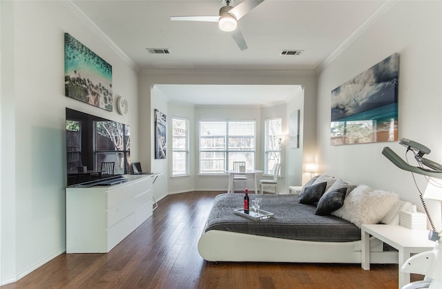 bedroom with dark wood-type flooring, crown molding, and ceiling fan