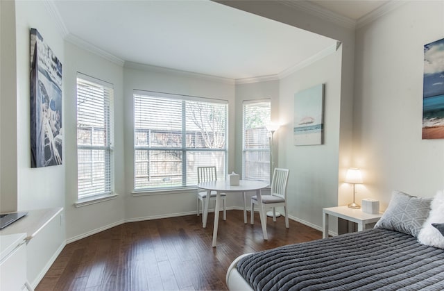 bedroom with dark wood-type flooring, crown molding, and multiple windows