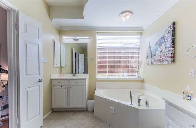 bathroom featuring vanity, crown molding, tile patterned flooring, and a bathing tub