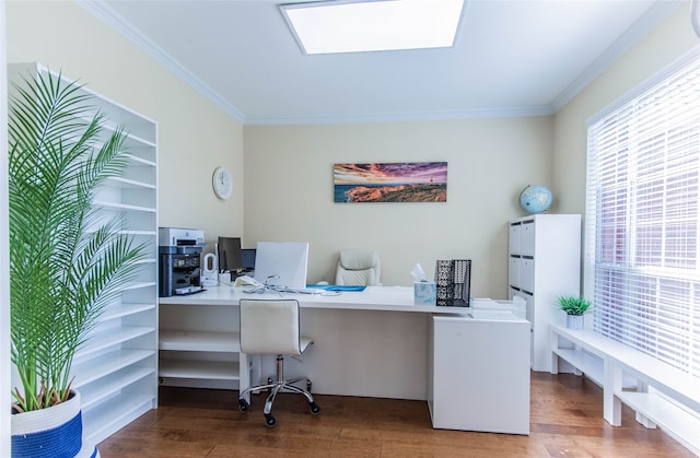 office with crown molding, hardwood / wood-style flooring, and built in desk