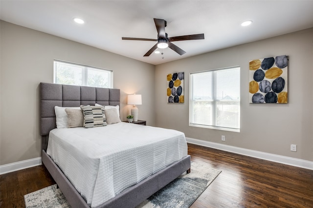 bedroom with ceiling fan and dark hardwood / wood-style flooring