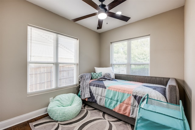 bedroom with hardwood / wood-style flooring and ceiling fan