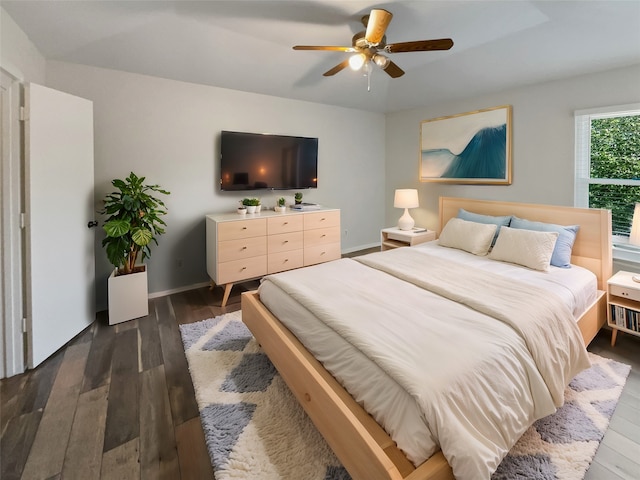 bedroom featuring dark wood-type flooring and ceiling fan