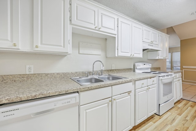 kitchen with white cabinetry, a textured ceiling, sink, white appliances, and light hardwood / wood-style flooring