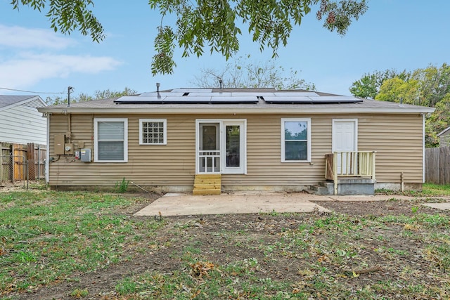 back of property with solar panels