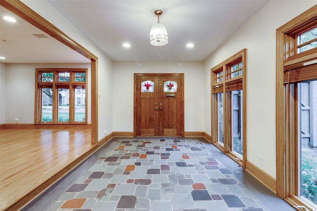 foyer entrance featuring dark wood-type flooring