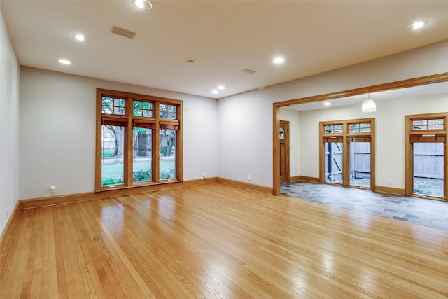 unfurnished room featuring light hardwood / wood-style floors