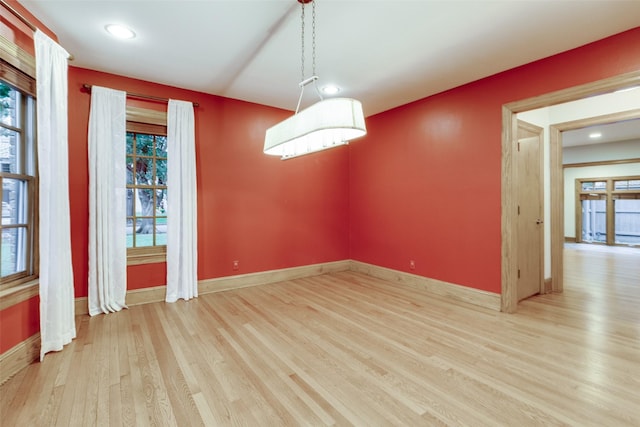 unfurnished dining area with light hardwood / wood-style flooring