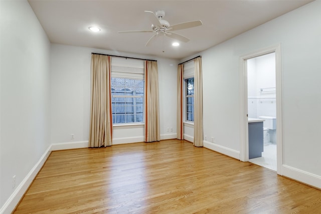 unfurnished room featuring light hardwood / wood-style flooring and ceiling fan