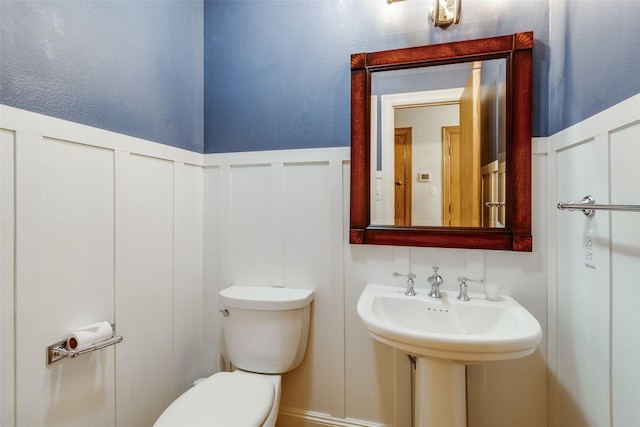 bathroom featuring sink and toilet