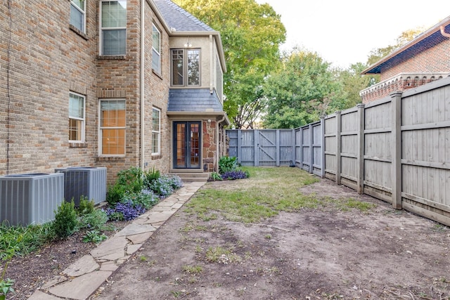 view of yard with central AC unit