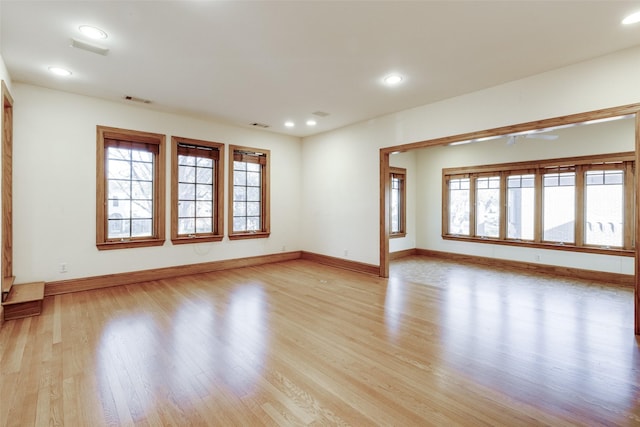 spare room with light wood-type flooring