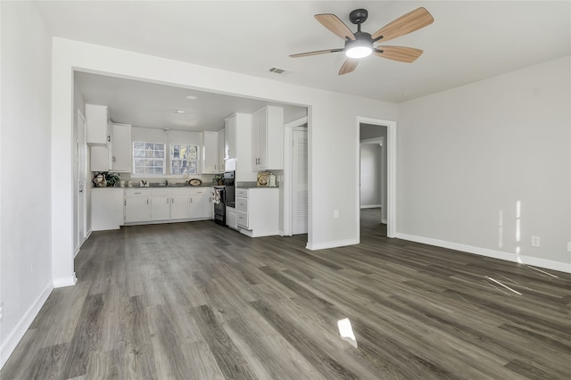 unfurnished living room with hardwood / wood-style floors and ceiling fan