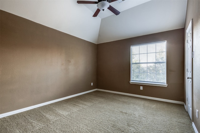 carpeted empty room with ceiling fan and lofted ceiling