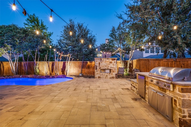 patio terrace at dusk with area for grilling