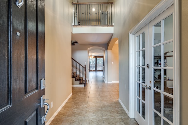 tiled foyer entrance with french doors