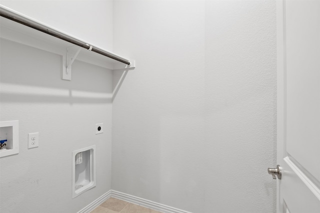 washroom with hookup for an electric dryer, washer hookup, and light tile patterned floors