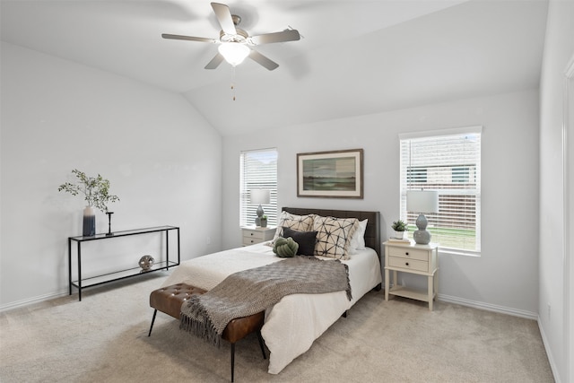 carpeted bedroom featuring lofted ceiling and ceiling fan