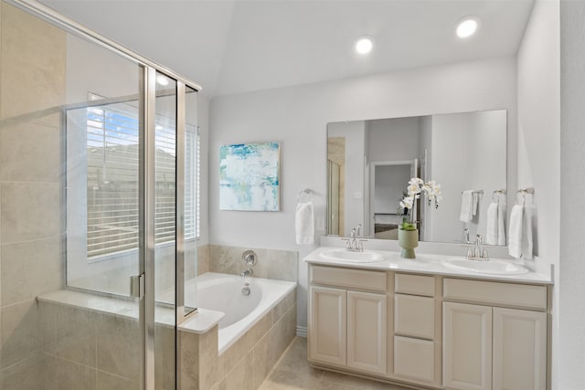 bathroom featuring vanity, shower with separate bathtub, and tile patterned flooring