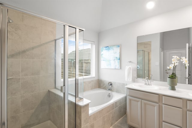 bathroom featuring vanity and shower with separate bathtub