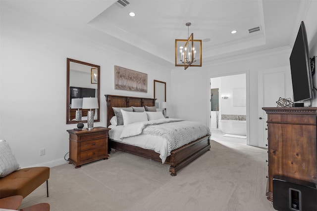 bedroom featuring a tray ceiling, connected bathroom, crown molding, an inviting chandelier, and light colored carpet