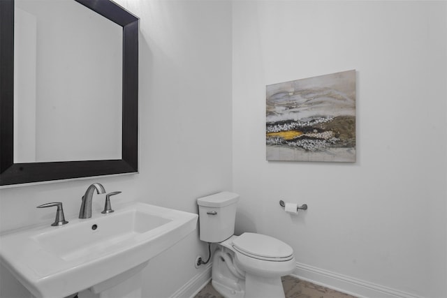 bathroom with sink and toilet