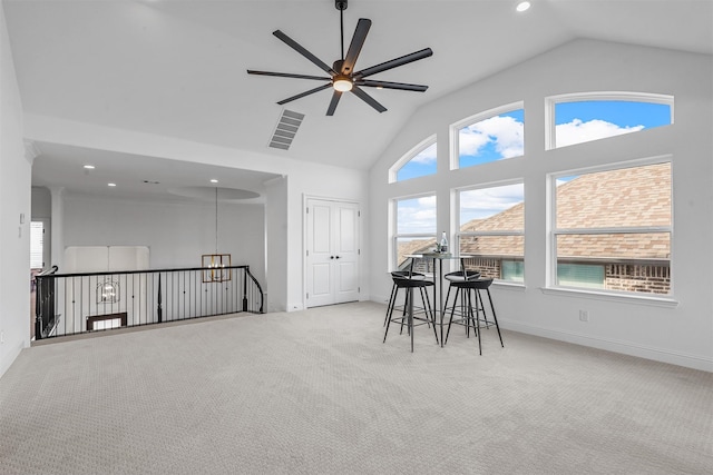 interior space with ceiling fan and high vaulted ceiling