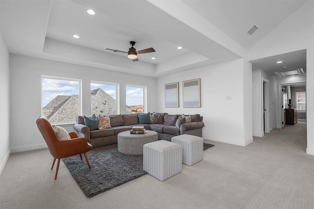 living room featuring light carpet and ceiling fan