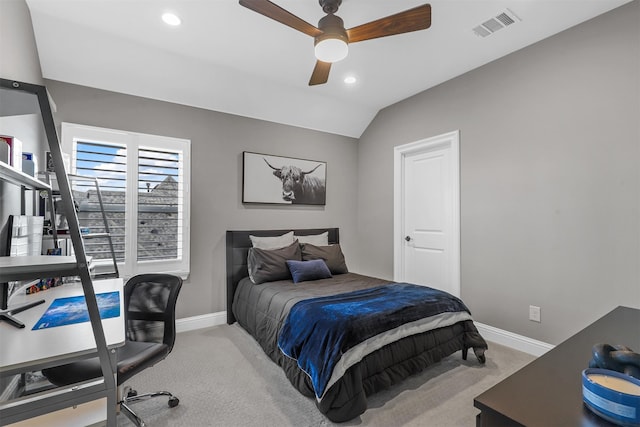 carpeted bedroom featuring ceiling fan and vaulted ceiling