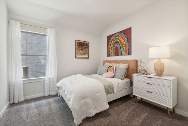 bedroom featuring vaulted ceiling and dark colored carpet