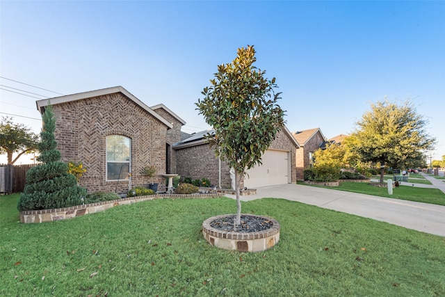 view of front of house with a front yard and a garage