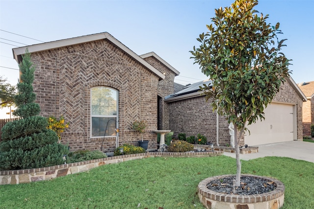 view of front facade with a front yard and a garage