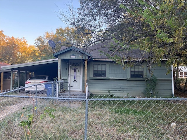 view of front of property with a carport