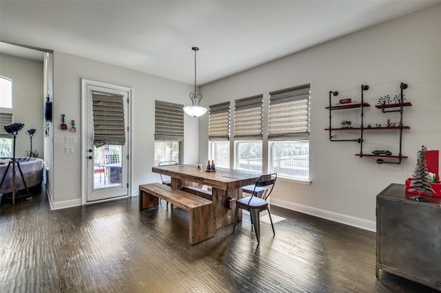 dining space with a fireplace, ceiling fan, dark wood-type flooring, and built in shelves