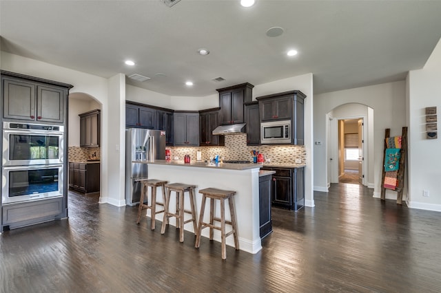 dining room with plenty of natural light and dark hardwood / wood-style floors