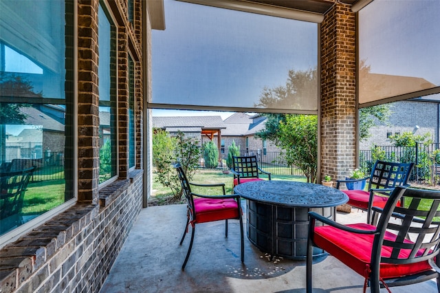 balcony featuring a fire pit and a patio area