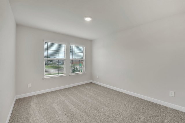 empty room with carpet flooring