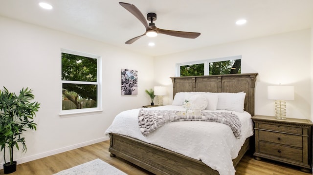 bedroom featuring ceiling fan and light wood-type flooring