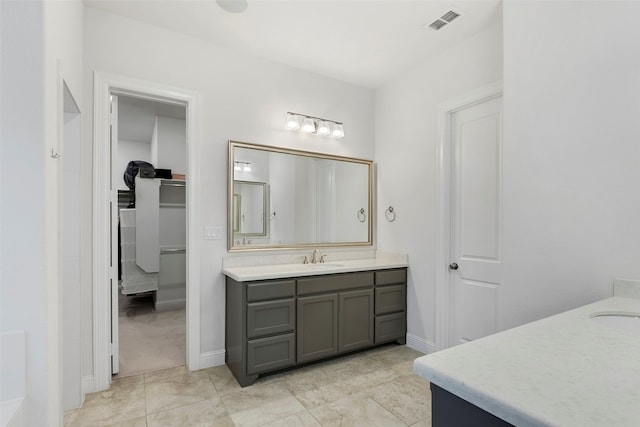 bathroom featuring vanity and tile patterned flooring