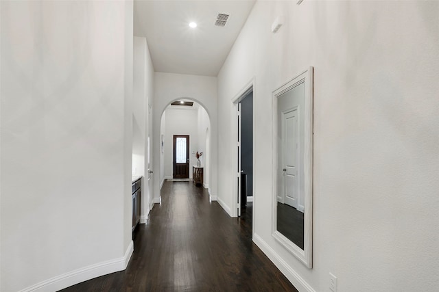 hall featuring dark wood-type flooring