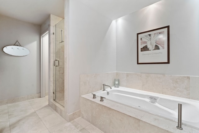 bathroom featuring tile patterned flooring and separate shower and tub