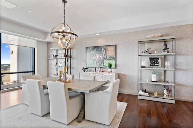 dining area featuring a chandelier and dark hardwood / wood-style flooring