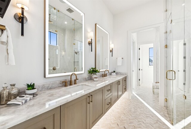 bathroom with an enclosed shower and vanity