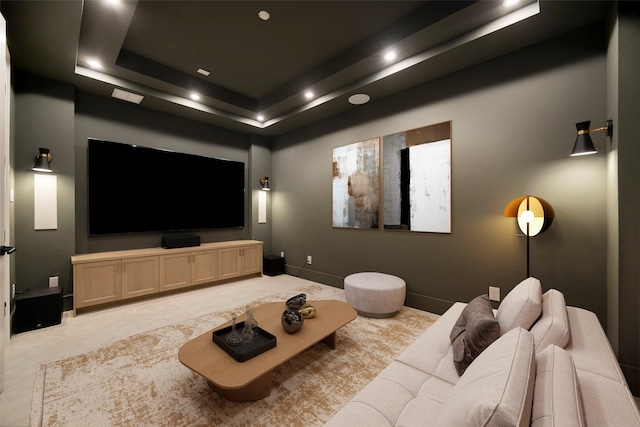 cinema room with a tray ceiling