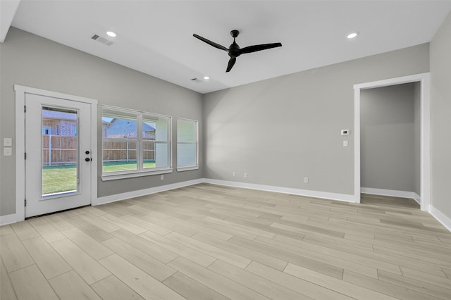 unfurnished room featuring ceiling fan and light hardwood / wood-style floors